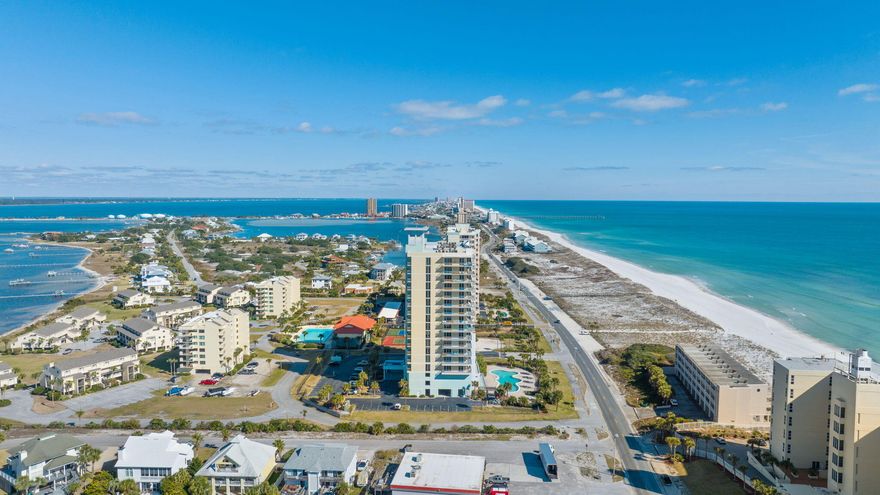 Experience the best of Pensacola Beach at this one-of-a-kind residence filled with luxury & exclusivity, offering 2-bedrooms, 2-bathrooms + bonus bunk room. Located at the ever-popular Emerald Dolphin, this impressive condo features 1,345 square feet of living space & the perfect accommodations to make the beach your next home. The views of glistening emerald, green waters & sugar white sands of the Gulf of Mexico are instantly captivating from the moment you enter the condo. Views are abundant and never-ending - You can be in the comfort of your living room relaxing after a day of fun in the sun, or out on the spacious balcony catching the best sunrises, sunsets or even the famous Blue Angels & you will find that the sights from this condo will not disappoint. The interior is just as