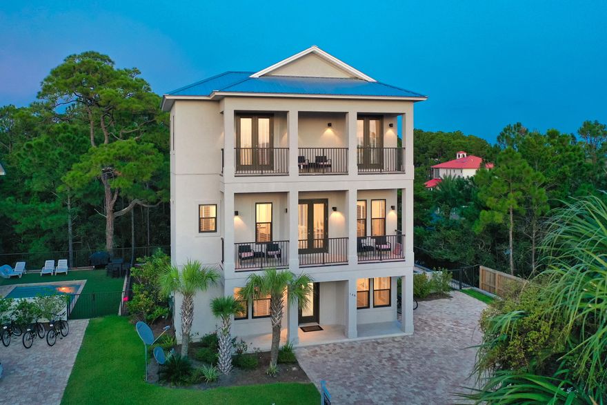 This remarkable coastal home, with no HOA, is prominently located on the West end of 30A offering exceptional proximity to 30A's newest beach access equipped with ample parking and public restrooms. Luxurious interior and exterior finishes and professionally furnished by Coastline Interiors, this turn-key property, built in 2017, features six bedroom suites with impressive rental projections exceeding $130,000 in gross annual revenue. Notable amenities include an over-sized lot with ample parking, private gated pool area well-designed with a sun deck and wrap around putting green.
