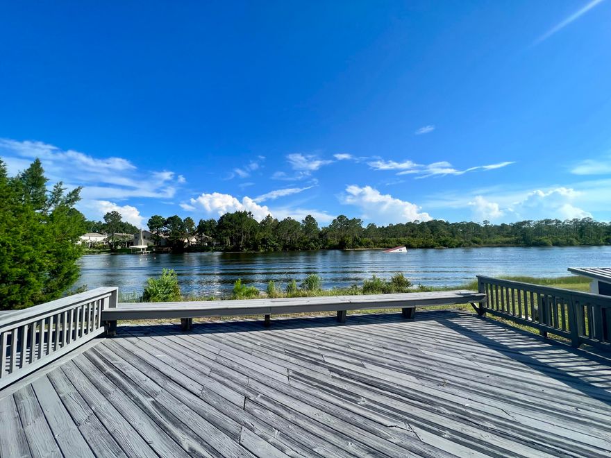 Dreaming of a lakeside residence, vacation home or rental investment with endless possibilities, then look no further. This quaint lake front  home is located in the Shortline Lakes Estates subdivision on the south side of Highway 98 and close to 30A. Its unique 4 bedroom plus office and den floor plan has over 300 feet of water frontage. Fantastic sunsets from the back deck, or one of two observation pavilions. From the 3rd floor viewing room you can watch champion skiers from all over the world.  Lakes are privately owned. Fresh paint inside and out, new appliances and carpet throughout this lake front property. Sprawling decks that surround the perimeter of the home and an oversized lot of .7 acres offer a ton of potential to add on our have a guest home or additional structure.