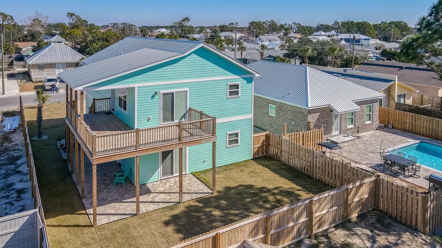 Amazing opportunity to own a new high quality built BEACH HOUSE with all the bells and whistles. Just blocks from the World's Most Beautiful Beaches and the down the street from several public boat ramps. Main Upstairs is 1344sqft with 3-bed 2-bath (2.5 ton HVAC) and downstairs unit is 658sqft with 1-bed/1-bath (1.5 ton HVAC) and separate entrance. Builder thought about every detail and spared no expense, including pavers driveway, underground power, kitchen cabinets and drawers are soft close, LVP throughout, LED flush mounted lights, 9ft ceilings, delta fixtures, each unit has a 250 gal commercial water heater and its own laundry room. The oversized garage (and attic) has spray foam insulation and will fit the BIG TRUCK plus plenty of space for storage. Additional features include an outdoor shower, fenced backyard for privacy and has even space for a pool since the septic tank in the front yard. Being sold furnished with washer & dryer in both units. No HOA, and Short Term Rentals ARE Allowed. All measurements are approximate, please verify if important