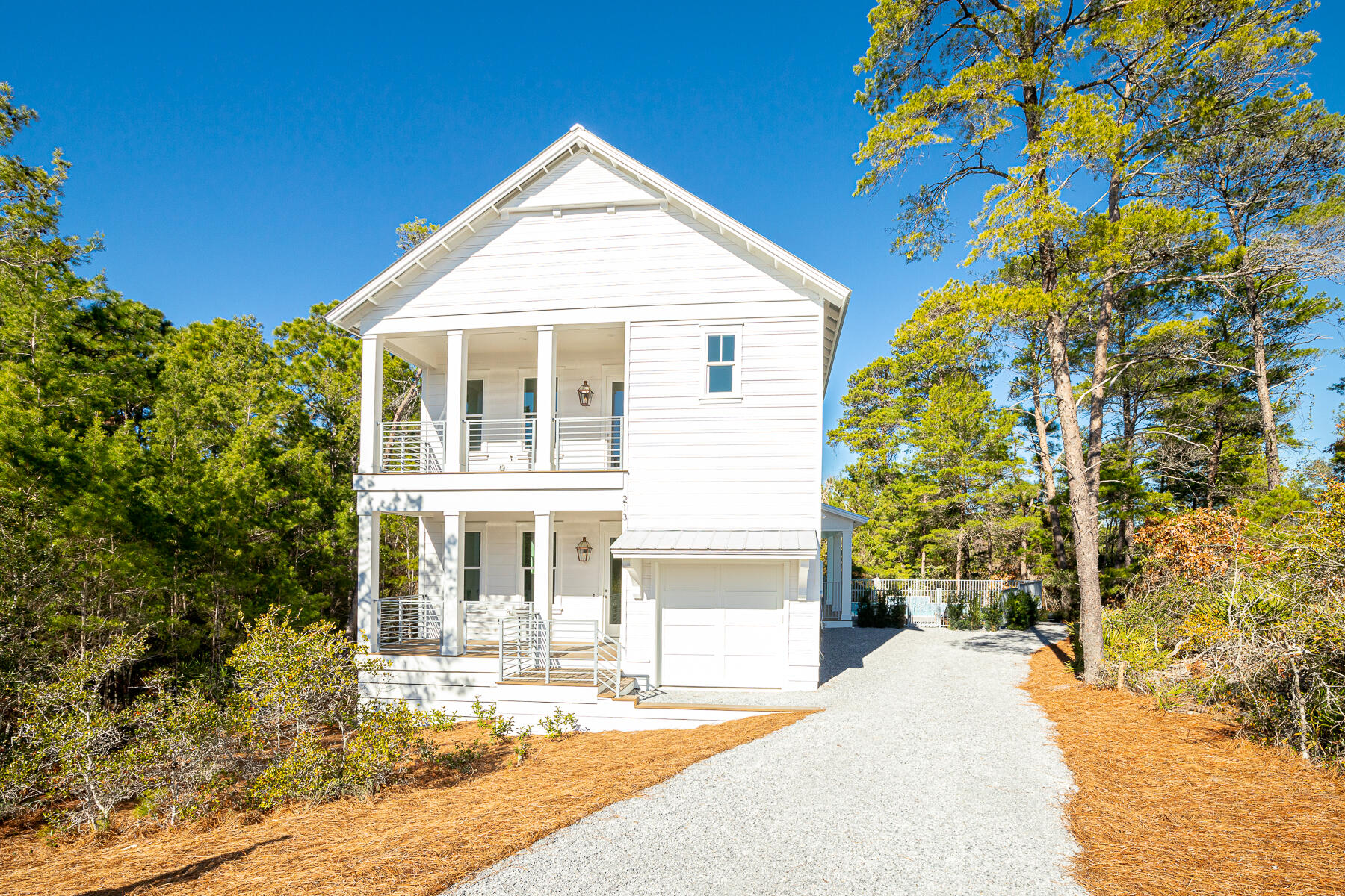 Seller is offering a $10,000 credit toward Buyer closing costs. Welcome to the tranquil setting of this newly completed 4 bedroom home, a hidden gem along the west end of 30A. Whatever your dream checklist, 213 Spotted Dolphin has it all. Want to live at the beach with a private pool? Or would you like to maximize your investment with the projected rental income of $130-160k. This tucked away, cul-de-sac location has no association fees and 3 public beach accesses within a mile range. Upon entering the home, you will immediately sense the quality construction with curated lighting package, shiplap walls, 10-foot ceilings throughout, and generous storage areas. The ground level offers a junior master suite, an open concept great room, with spacious kitchen featuring quartz countertops and gas range. The second floor offers Step outside for a dip in your private pool adjacent to preserved green space. You will enjoy catching the sound of the waves of the Gulf of Mexico on those southern winds.
The second floor showcases your primary master quarters complete with a large bathroom and walk-in closet. Additionally you will find two Guest suites, a secondary living area, and Bonus room perfect for an office, storage or bunks. With generous closets and storage, as well as a golf cart sized garage, this home presents as an excellent option for a full time, second home or short-term rental property. Enjoy world class dining and boutique shopping as well as the conveniences of nearby schools, hospitals and grocery stores. Join others who own and love the beauty of life on Spotted Dolphin!