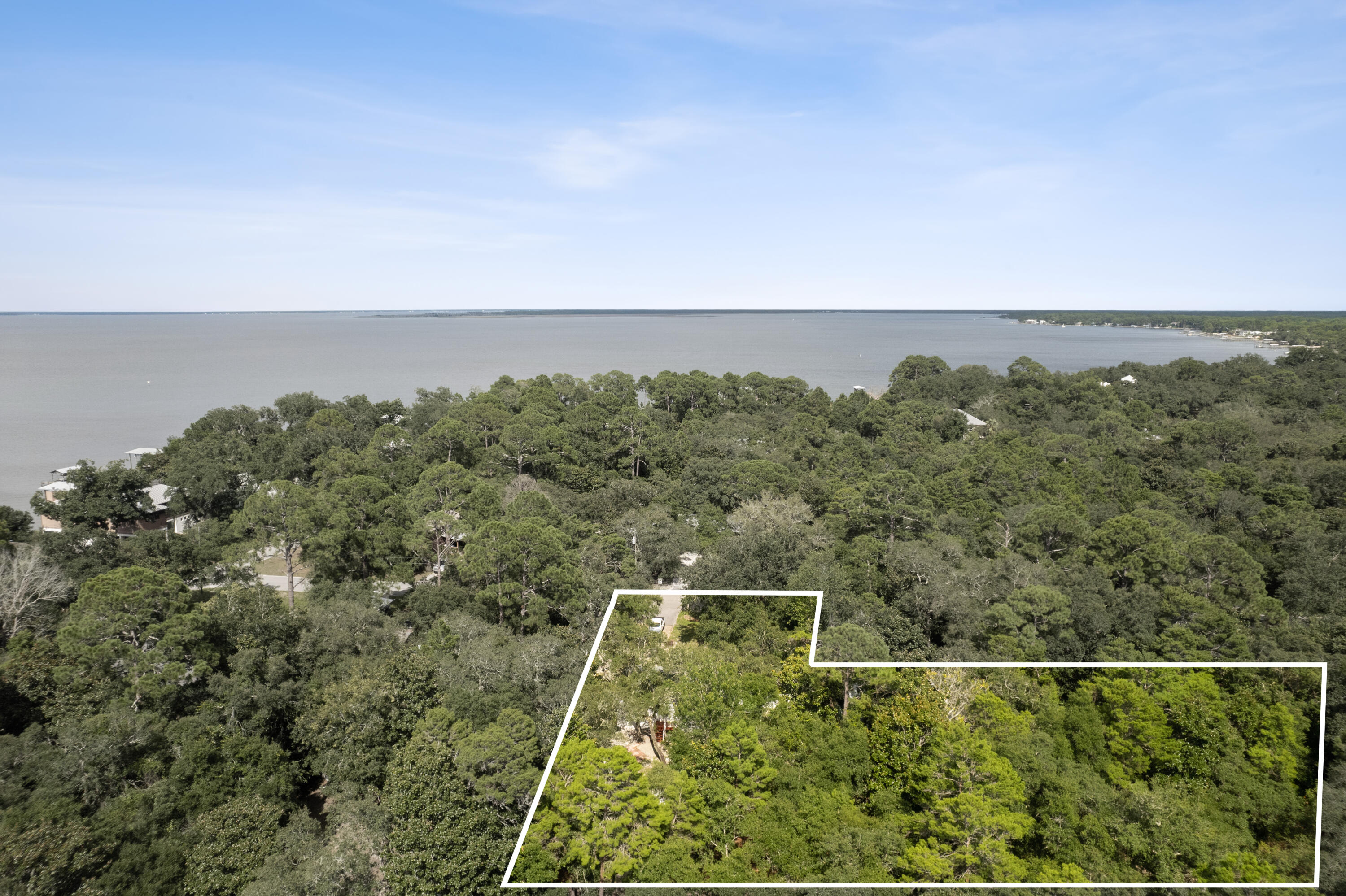 Location* High and Dry, NO HOA investment or development opportunity. This .26 acre lot is a mile away from Sacred Heart Hospital and minutes away from all that Destin and 30A beaches have to offer. Currently outfitted with slab, power and plumbing for RV storage. Option to purchase conjoining .26 acre lot (listed separately) is available also, for a total of .56 acres currently available on Turquoise Beach Dr.