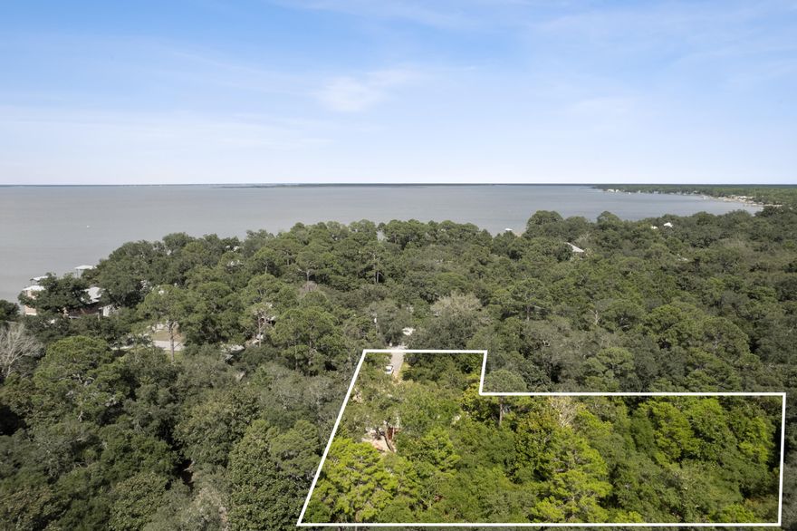 Location* High and Dry, NO HOA investment or development opportunity. This .26 acre lot is a mile away from Sacred Heart Hospital and minutes away from all that Destin and 30A beaches have to offer. Currently outfitted with slab, power and plumbing for RV storage. Option to purchase conjoining .26 acre lot (listed separately) is available also, for a total of .56 acres currently available on Turquoise Beach Dr.
