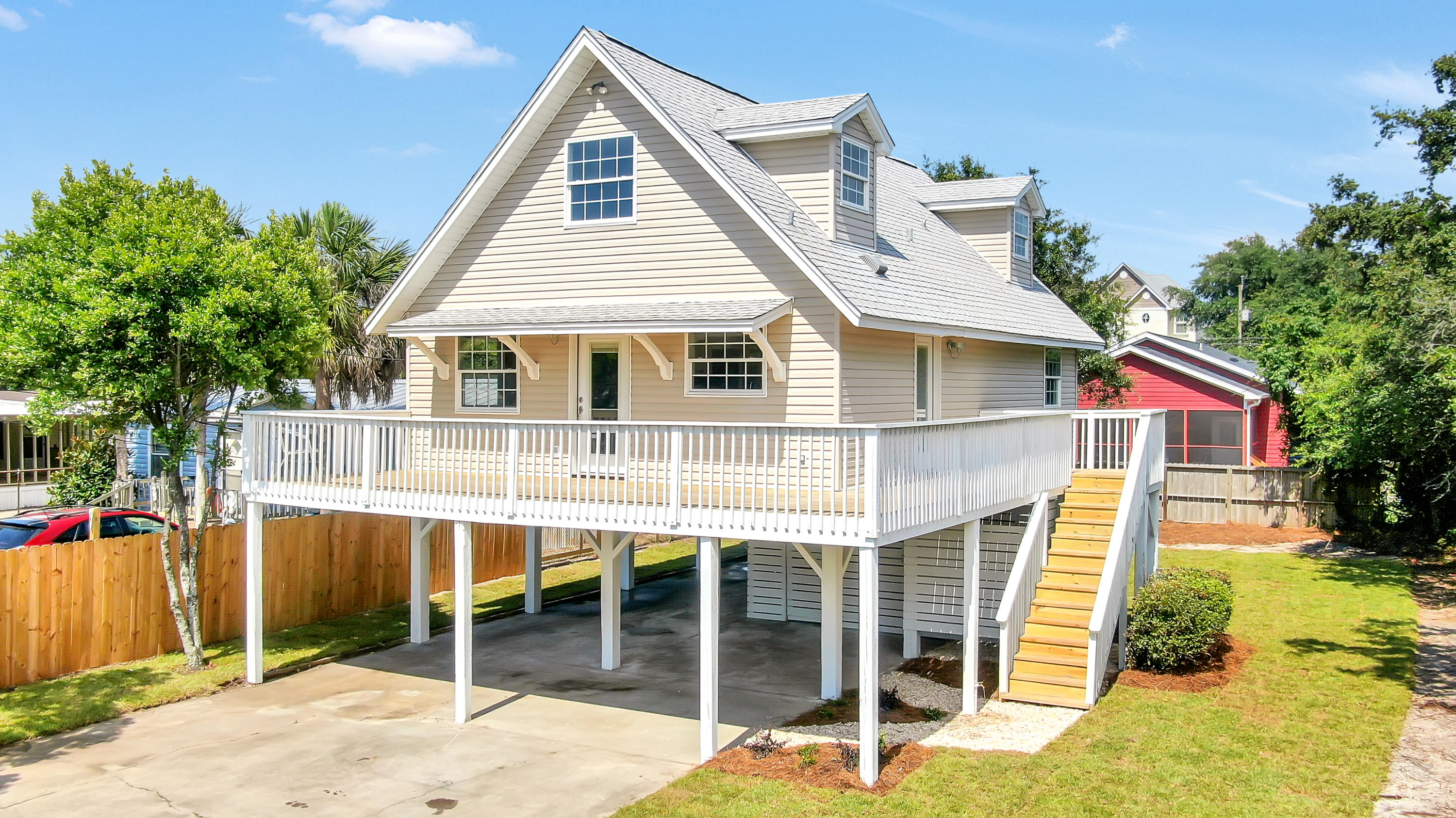 Rare find!!! Updated four bedroom on the west end of PCB!! Proudly sitting atop pylons on a large lot, this home offers plenty of storage for beach toys and golf carts. The wrap around porch offers ample space to watch the sunset while enjoying a drink. Stepping into the living room, the beautiful shiplap walls and open floor plan make it the perfect place to watch the big game, and entertain guest. The new kitchen cabinets offer an abundance of storage. Just off the living area, the master bedroom & guest rooms offer privacy and large closets. The main bathroom has been updated with beautiful tile and butcher block shelving. Two bedrooms and bath upstairs offer an escape for your guests. This property has huge rental potential. BOOK your appointment today!