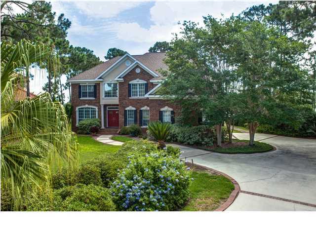 An absolutely gorgeous waterfront lot in Kelly Plantation is the backdrop for this lovely 4,000 square foot, 4-bedroom home! Approximately 150 waterfront feet on Jones Bayou, close to the mouth of the Choctawhatchee Bay, allows for beautiful views, cool breezes (even in summer), the peaceful sounds of nature, and deep water access. The house was designed to take advantage of the location with 2 stories of windows in the family room, waterfront views from the kitchen, master suite, office, and more, and a glass enclosed/screened sunroom facing the water on both floors, providing for year-round enjoyment of the water. The wide foyer opens to a formal living room and dining room, with recessed ceiling, crown molding, and recessed lighting. The family room includes built-in shelves, a gas