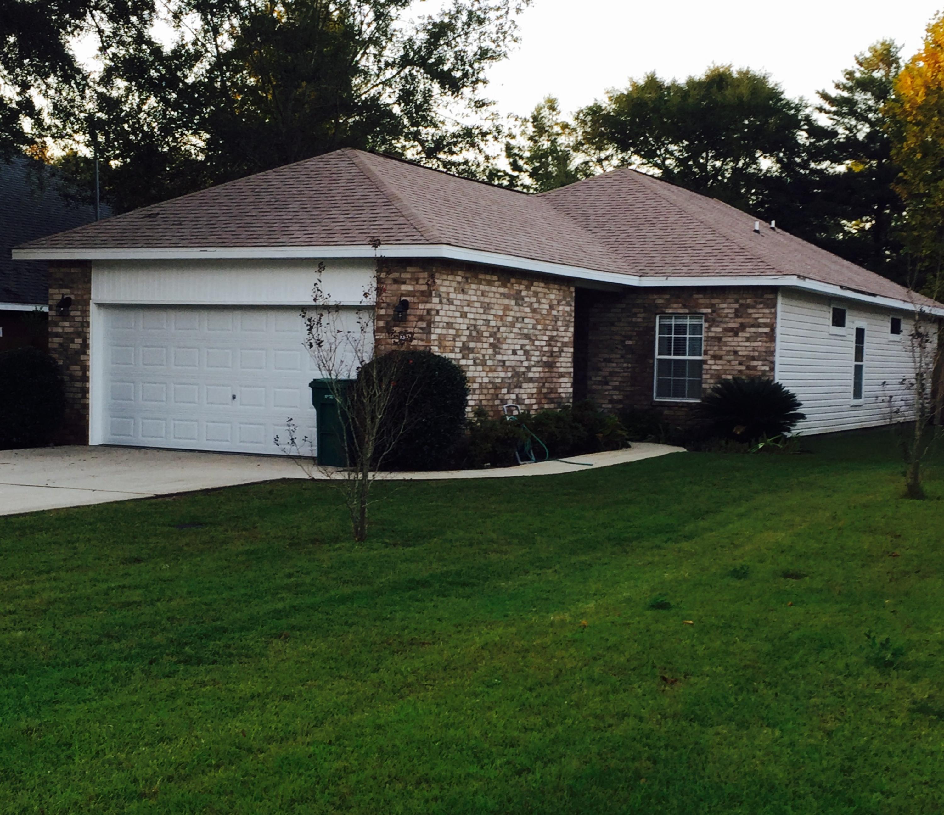 MUST SEE...Nice, newer brick home in the very desirable Shalimar area; close to schools, dining, shopping, churches, & both bases. You enter the home into a cozy foyer that leads to the tiled dining room that opens into a lg living room. The 2 addit. bedrms, 2 closets, & guest bath are off the entry/dining room & the lg master is off the Living room. Master boasts trey ceilings, lg walk-in closet, & double sink vanity. Kitchen has all stainless steel appliances that convey, walnut cabinets, & lg pantry, indoor laundry room leads to the 2 car garage w/tanning bed. Fully privacy fenced backyard w/a nice open patio for entertaining (hot tub hook ups) Yard is nicely landscaped for easy maintenance.Freshly pressure washed, cleaned, & Turn-key ready!! Call to see today, it won't last long!