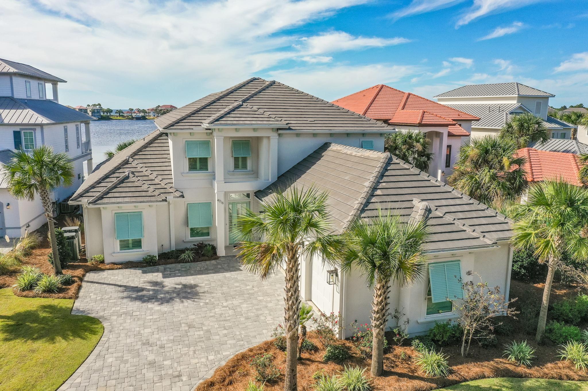 Custom Built two year old 6br house on the lake in Destiny East with Gulf views. No details were spared when this house was built and has all of the current finishing touches and accessories that one expects for a home of this stature. This home boasts a wide open floor plan with views from every room, state of the art kitchen, high ceilings, custom cabinets, ample outdoor space, a three car garage and so much more. The outdoor living space includes a summer kitchen and infinity edge pool overlooking the lake to enjoy fantastic sunsets. This home truly needs to be seen in person to appreciate all the details and will make a perfect primary residence or investment property for its next owner. Rental projections are 116k for a 5br and 125k for a 6br as owners use one bedroom as an office
