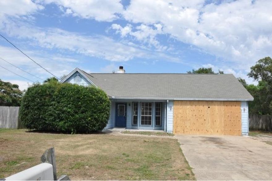 REO. Home is in need of TLC. Home offers 1,302 square feet of living space, three bedrooms, and two full bathrooms. Home is located close to shopping, schools, and within 10 miles of Hurlburt Field.