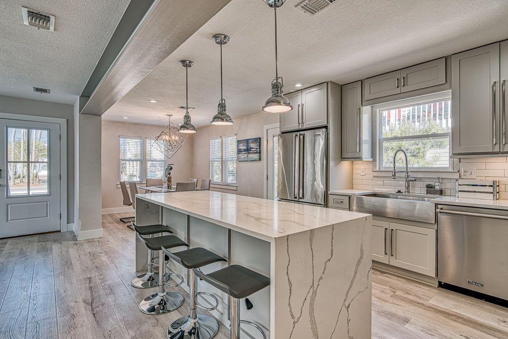 Prominently located less than a block from the beach in the highly desirable Crystal Beach area of Destin. Currently utilized as a vacation rental, 'Crystal Escape' boasts many high end finishes including Viking appliances and Marble countertops, just to name a few. There are 3 bedrooms/3 baths in the main structure, 3/2 plus garage in the carriage house, a pool / outdoor entertainment area in between and parking that can accommodate 8-10 vehicles. Less than a block to the beach and offered completely furnished; full of designer furniture and high end electronics.