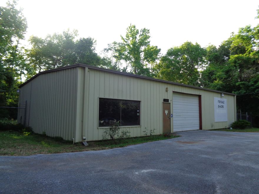 19.5 Acres fronting St Hwy 81 and backs up to CB Whitehead Rd. Located on the front of the property is a metal building used many years as an automobile repair & paint shop. Building is 2,340 sq ft with 3 roll up doors, office area and bath. Area back of building is fenced. Also on property is a extra large Barn or 3 vehicle garage. Includes 3 roll up doors, concrete floors, water and electrical service plus covered pole barn area. This beautiful property has a wet weather cypress pond. Wildlife abounds on property making it perfect for hunting - deer, turkeys, etc. Property has a number of approved uses in the agriculture land use, contact Walton County Planning with questions. Located 37 minutes from Beaches.