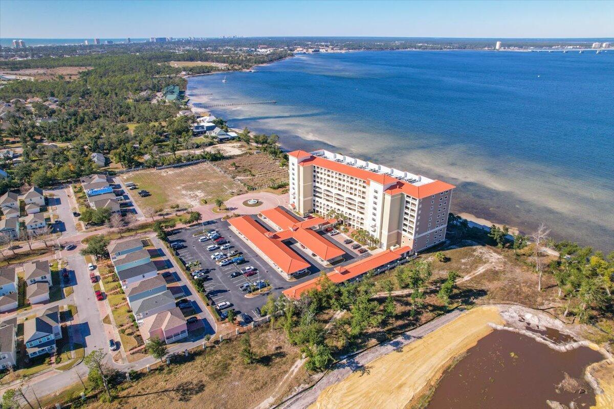 Welcome to Magnolia Bay Club, a waterfront gated community. This highly sought-after top floor unit features 3BR/3BA and offers a spectacular unobstructed view of the bay. When you enter the unit, you will notice the beautiful tile flooring and a hallway leading to the kitchen, living room and master bed/bath. The kitchen is open to the living room and dining room and features wood cabinets, granite countertops, stainless steel appliances and extra storage/cabinetry under the breakfast bar. The cozy living room has a beautiful backdrop of the bay and a glass sliding door leading to the balcony. Next you will find the master bedroom which features French doors at the entry, a stunning view of the bay and a glass slider leading to the balcony. As you head towards the master bathroom you...