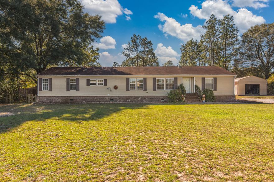 Well maintained 4 bedroom plus office home on .91 acres with many upgrades including brick skirting with brick stairs walk up to front door. Two living room areas and large open kitchen. The kitchen boasts a massive island & ample counter & cabinet space for all your cooking needs. There is enclosed shop perfect for tools and toys equipped with power. Large Florida room on the back of the home great for entertaining and to be used as a flex room for whatever your needs are. The spacious almost 1 acre yard provides plenty of area for the kids and family dog to run around & play!