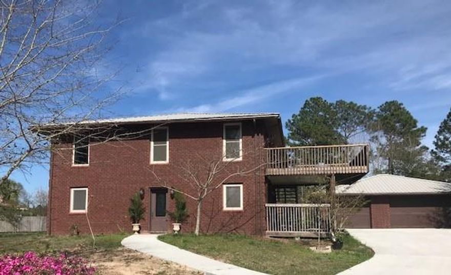 SPACIOUS home on 1/2 ACRE LOT with 3.644 sq ft 3 bedrooms 2 full baths & 1 half bath..ENERGY EFFICIENT, close to beautiful Navarre BEACH, a DETACHED 3-Car Garage with full Bathroom & kitchenette. Built Strong, walls 12'' thick, TRIPLE PANE WINDOWS. FEATURES an Open Floorplan, Stained Shiplap Accent Wall, TANKLESS Water System, METAL ROOF, lots of CLOSETS, ALL kitchen appliances convey as well as Murphy's Bed on 2nd LEVEL. ICF construction (INSULATED CONCRETE FORM) found to be tornado & hurricane resistant which is based on how the wall of the home is constructed. **13 MONTH HOME WARRANTY