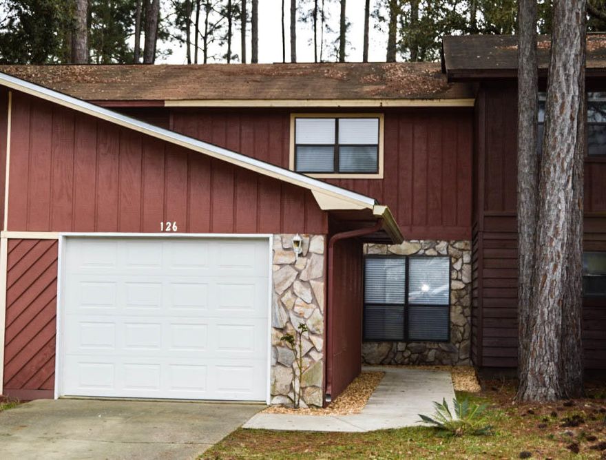 Completely UPDATED!!! Check out this spacious town home it has 3 bedrooms 1 full bath and 1/2 bath. It has a separate oversized 1 car garage, with a breezeway to the entrance of the home. This sits on a very large lot, with a ton of extra space in the back. Home has new appliances, quartz in the kitchen, New tile, carpet, doors, trim, paint, New glass in all the windows, 2'' faux white wood blinds.Bathrooms have been updated with new tile, fixtures, vanities, etc. An oversized deck (20x14) extends your living space, lot is huge and privacy fence can be extended. Tons of storage with large closets and an extra under the stair storage space. Centrally located with no HOA and an Easy commute to all bases. Walk to schools, restaurants and parks. Great starter home or investment property