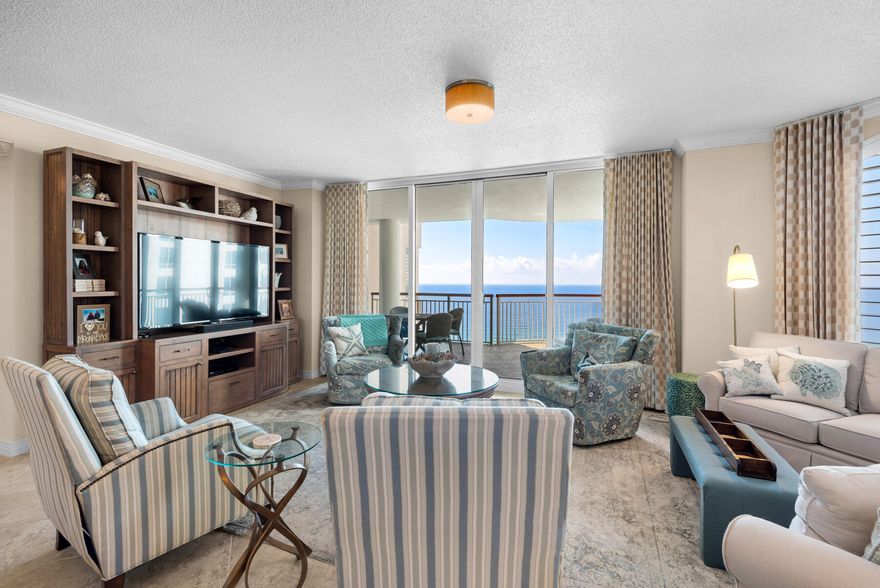 Simply the best! This 14th floor 3br/3ba west view unit has a coastal elegant decor and has never been rented. It has tile and granite counter tops throughout, plantation shutters, custom drapes, crown molding, and renovated bathrooms with non-slip travertine tile showers, and new water heater. Come experience Navarre Beach and see there is no comparison to the trendsetting architecture, the spaciousness, the privacy and circular terraces everyone will enjoy. Amenities include covered parking, Olympic size swimming pool, tennis/pickle ball courts, fitness room/social center with a full kitchen for parties and entertaining. This unit is sold fully furnished.