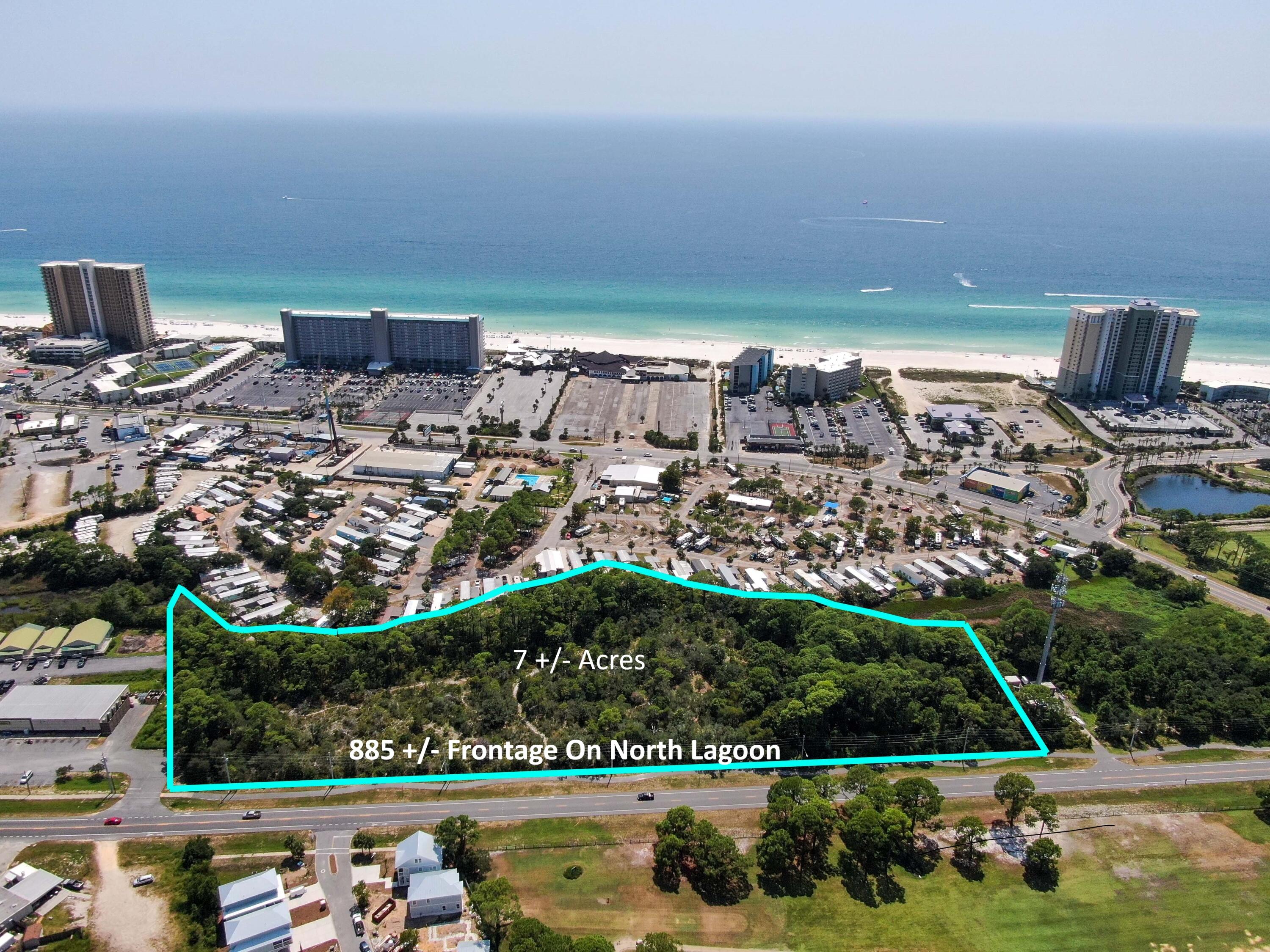 7 Acres in the Heart of Panama City Beach located across from Signal Hill Golf Course. Prime location for a hotel, multifamily development or resort. Almost 900 feet along North Lagoon, you are less than 1500 feet to the beach. This property is located in the Tourist District and is zoned Commercial High Intensity. The property can be developed for up to 200 hotel rooms or 74 townhome units.  Conceptual Renderings are available. Topo and Boundary Survey on File.