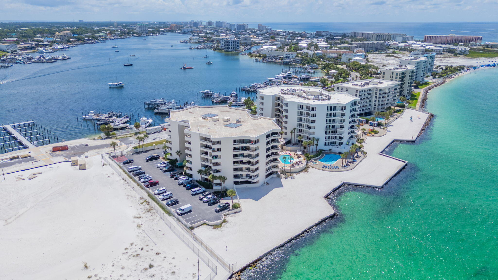 Welcome to your slice of paradise! This gorgeous beachfront condo has it all--sparkling white sand on site, and sweeping Gulf, Bay and Harbor views from oversized balconies. Daily sightings of dolphins and sea turtles in this stellar location. Inside, you'll love the bright and breezy vibe with a fully remodeled condo featuring an open kitchen that flows perfectly into the spacious living area. 180 degree Beach and harbor views make this unit one of a kind. This condo is sold fully furnished and rental ready with a full load of rentals on the books!Not only does this unit have a premier location it comes with private parking and a secure storage unit for all your beach gear! This condo boasts fantastic rental numbers making it a dream investment and unforgettable second home. Additional bonus':
FULL size Washer and Dryer in unit
Community pool and hot tub
Community marina and water taxi
Heated pool and hot tub
Complex gym
Private beach access
Private covered parking and storage