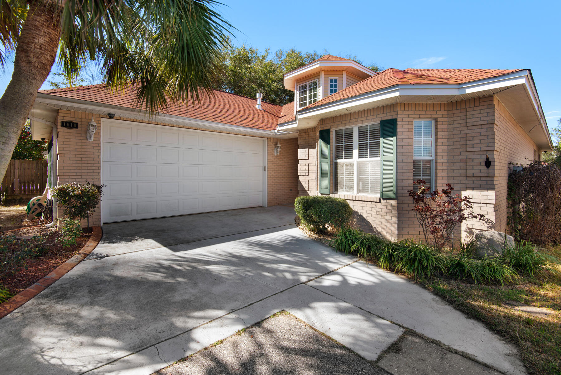 3 bedroom 2 bath, 2049 square foot home in an established gated Niceville, Bluewater Bay community! Nestled in the beautiful section of Mediterranean Village,this home has an open floor plan, tall ceilings, and several built-ins forentertaining or storage. The kitchen has an abundance of cabinetry and generouscounter space for food preparation. The updated kitchen has new stainlessappliances and striking quartz countertops. Natural light floods the dining area, which is adorned with a tray ceiling. The entertainment room features built-ins and a wet bar. Throughout the home is beautiful and practical rich bamboo flooring, except in the kitchen, baths, and laundry room where attractive tile is laid. The split floor plan offers privacy. A tray ceiling and crown molding adds simple elegance to the primary bedroom. The primary bath is lined with two long vanities separated by a large jacuzzi tub, a walk-in shower, and a spacious walk-in closet. The second and third
bedrooms, which share a full bathroom, are well proportioned. The laundry room is conveniently located off the garage. The garage accommodates a full-size truck and is equipped with a pull-down staircase that leads to an additional storage area. The
private backyard is designed for easy maintenance and entertaining. The house has gas heat and hot water and is plumbed for a gas range. A NEW ROOF was installed
in 2023. This nicely appointed home is conveniently located a quick ten-minute drive from the Emerald Coast pristine beaches, shopping, and entertainment, and only minutes from golf courses, tennis, and other amenities in Bluewater Bay as well as
the boat ramp and campground at Rocky Bayou State Park. Commuting to Eglin Air Force Base is a breeze from this quiet neighborhood just off Route 20. Whether you are seeking a family residence in a vibrant neighborhood, a perfect location for the single person or a solid investment property, this well-maintained and updated home checks all of the boxes!