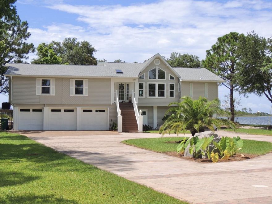 Enjoy the Florida Coastal Lifestyle in this 4 bedroom, 3 baths recently renovated beautiful home on acre lot with 120 ft of waterfront with new roof. The home is filled with natural lighting throughout.  Living room and dinning area have high ceilings and water views. The kitchen features a center island with cook-top, dolomite granite counter tops, SS appliances, and Thermador Steam oven.  Stunning water views from the master bedroom and bath which has a claw foot tub and leather granite vanity top.  Porcelain tile floors throughout the home and floor level impact hurricane windows and doors.  Sprinkler system,  dockside shower and newly renovated thruflow dock and boat lift.  Spectacular back yard panoramic views of nature and Santa Rosa Sound.  Large open deck, great for entertaining.