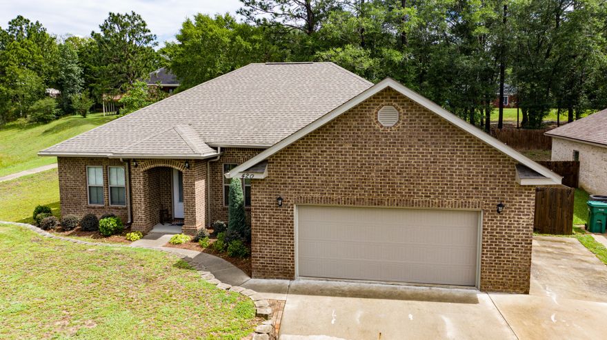 This custom 4BR 2 1/2 BA all brick home w/ an open split floor plan. Main living areas have 20x20 tile, and hard wood in the dining room, and carpet in the bedrooms. If you like to entertain you will love the 10ft ceilings, recessed lighting that opens directly to the kitchen. In the kitchen you will find stainless steel appliances, granite counter tops, breakfast bar and nook. The master suite is large and private. The master bathroom has a large garden tub w/tile backsplash. The separate tile shower has 6'x4', seat, sprayer and a huge walk in closet. Gulf Power Earth Cents home is all-electric featuring R-13 wall & R-38 ceiling insulation. The back yard extends beyond the fence for an additional .30 acres in total makes up the .60 acre lot. $5,000 towards Buyers CC with seller approval!