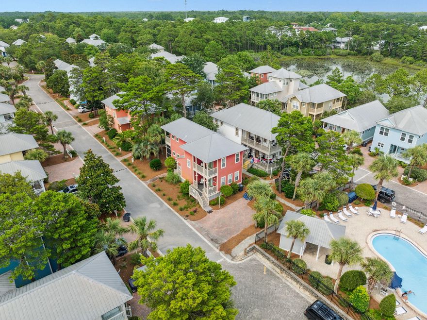 Welcome home to one of the best kept secrets along 30A - Old Florida Village! With just 75 homes nestled between palms and pools in this gated neighborhood, you'll fall in love with the colorful coastal cottages and close-knit community feel the moment you drive in. This two-story home is perfectly situated on a premium lot just steps from one of two pools and features three bedrooms, each with its own private porch. A sought-after screened porch allows for enjoying the outdoors in any weather, and the additional front porch is perfect for taking in relaxing mornings and breezy evenings. Step inside to a bright, open-concept living space designed for easy coastal living. The kitchen boasts granite countertops, stainless steel appliances, a large center island, and a wet barperfect for entertaining guests. The adjacent dining and living areas flow seamlessly, creating a welcoming atmosphere for gatherings.

The exterior boasts Hardie Plank siding, a Galvalume metal roof, and a brick paver driveway, blending durability with classic beach cottage style. Located just steps from one of the two community pools, this home also benefits from lush, manicured landscaping maintained by the HOA.

Enjoy a quick and easy walk to three public beach accesses (Gulfview Heights, Spooky Lane, and Ed Walline State Park) and explore the nearby Shops at Gulf Place, offering boutique shopping, dining, and live music. Whether you're looking for a high-performing vacation rental, a peaceful second home, or a full-time coastal retreat, this home checks all the boxes.
