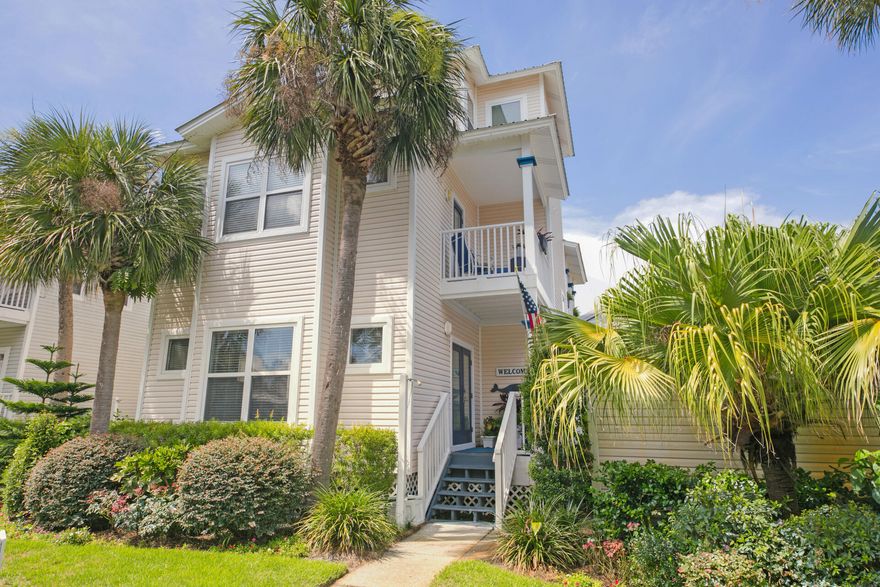 3 story, Three Bedrooms & Three Bath Cottage w/ Special Designer Features, including Lighting, wainscoting, upgrades & one of the LARGEST Floor plans!  The inviting front porch welcomes you & once you step inside, you will be delighted with the Open Living Room, Dining, Kitchen with quartz, glass tile backsplash, farmhouse sink & upgraded stainless appliances including induction stove & convection oven. Fully FURNISHED w/some exclusions. (Washer & dryer convey.)  Check out the creative Pantry! You will know this home has been loved & treasured!  Also on the 1st floor there is a Large Guest Bedroom (w/2 queen beds), private porch, & full bath.  Upstairs - 2nd floor you will find a spacious Primary Bedroom with private porch and ensuite bath; double sinks and soaking tub w/separate shower. Also, on the second floor is the 3rd bedroom with a full bath & the laundry.  ALL bedrooms have private Porches.  The 3rd floor Tower room has a glimpse of the Gulf, windows surround the inviting space; furnished with a seating area for reading a book or watching a movie along with a set of bunk beds w/trundle.  Property has new LVP on the first floor, along with hardwood flooring and tile! Beside the carport and driveway, a paver pad has been added for more parking.  A wonderful primary, second home or Investment Property!  Gulfside Cottages is a community of 29 homes located in Miramar Beach. Steps from the beach, with direct beach access from within the community, and/or from the beach access on Open Gulf Street. Neighborhood has sidewalks, picket fences, street lights, extensive tropical landscaping, an architecturally accented entrance designed for restricted access, a community 'heated' pool, and each cottage has a carport & storage closet.