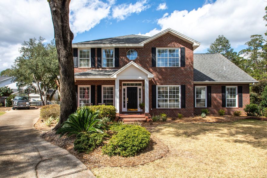 Welcome home to the charming Village of Bolton nestled in the gated community of Parkwood Estates of Bluewater Bay.  This custom 3,781 sq. ft. brick home by Gary Miller Homes boasts 4 bedrooms and 3 full baths all situated on a 0.41-acre lot at the end of a quiet cul-de-sac. Soaring ceilings and beautiful brand-new luxury vinyl plank flooring greet you upon entering the home with a formal dining room on the right and a flex space on the left, currently used as an office. The entire first floor features 9 ft. vaulted ceilings adorned with crown molding, chair rails, and cased windows. The wonderfully renovated kitchen with Caesarstone counters, under cabinet lighting, soft close cabinets, and high-end appliances is situated next to a bright and inviting living room with gas fireplace and...