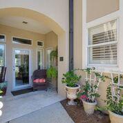 PRICE REDUCTION - MOTIVATED SELLER!! Breathtaking views of the lake and golf course from 3 sides of this end unit. Ground floor unit with no stairs inside or out. Enjoy the sunsets and fireworks in the Village from the porch swing on the screened porch. Updated through with natural limestone floors, granite counter tops, stainless steel appliances and crown molding. Freshly painted and fully furnished. Exceptional storage in the large garage, pantry/laundry and outdoor owners closet. Large bedrooms and the master suite has a custom walk in closet and large bathroom with whirlpool tub, shower and double vanity. You should be steps from the Turnberry Assoc. pool and a short walk from the tennis center, marina, 2 golf courses and the village.