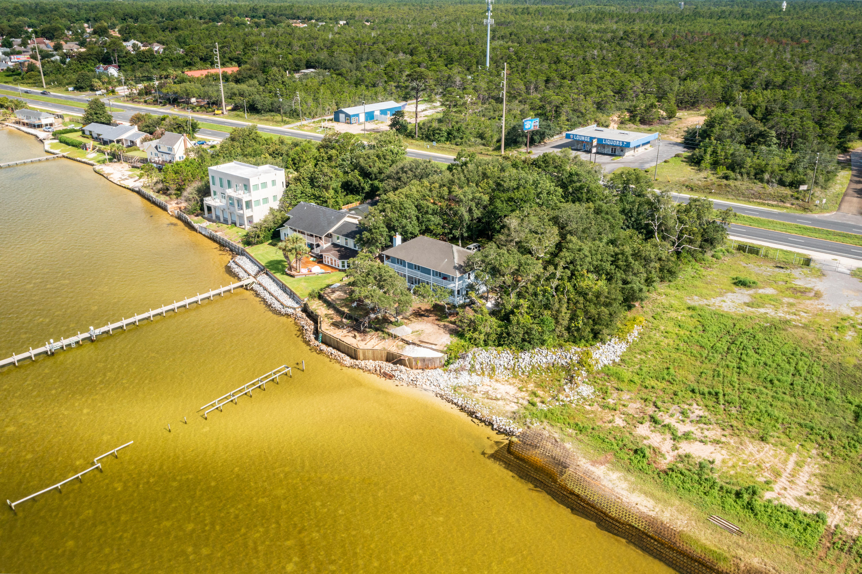Waterfront home overlooking Santa Rosa sound with pristine views of Santa Rosa Island. This home sits 13 feet above sea level & is in flood zone X. Mature trees add to elegance of the location. The home offers views of the sound from the main living area, breakfast nook, and 3 of the 4 bedrooms. The oversized garage gives you room for 2 cars, workbench & water toys. The potential of making this home your dream waterfront estate are endless. There are existing pilings for a dock and the seawall is currently being repaired to secure the property. An opportunity like this doesn't come often, come take look to see for yourself. The home is being sold ''As is with the Right to Inspect''. Currently accepting Back up Contracts