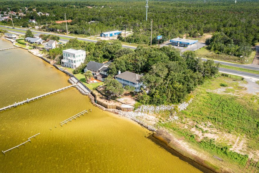 Waterfront home overlooking Santa Rosa sound with pristine views of Santa Rosa Island.  This home sits 13 feet above sea level & is in flood zone X.  Mature trees add to elegance of the location.  The home offers views of the sound from the main living area, breakfast nook, and 3 of the 4 bedrooms. The oversized garage gives you room for 2 cars, workbench & water toys. The potential of making this home your dream waterfront estate are endless.  There are existing pilings for a dock and the seawall is currently being repaired to secure the property. An opportunity like this doesn't come often, come take look to see for yourself.  The home is being sold ''As is with the Right to Inspect''. Currently accepting Back up Contracts