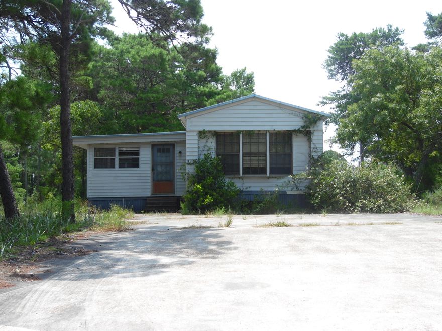 Great potential with this 3 bedroom 2 bath mobile home that comes with an additional lot.Live in the mobile and sell or build on the additional lot. With a little bit of love this mobile home would make a great beach retreat or a wonderful rental property .Nice location, only 10 minutes from the beach& Pier Park.