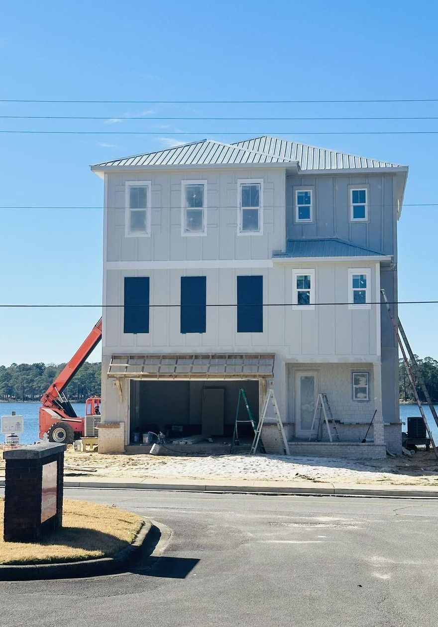 Thirty Days from Completion Welcome home to 309 Bayshore Drive. This brand new home is  located on the deep water of  Boggy Bayou. This lot has true deep water to accommodate almost any watercraft. The elevator spans all three floors. Tankless Gas Water Heater. 8ft solid core interior doors on the first and second floors. 3 Air conditioners. Spray Foam Ceiling Insulation. Over 700 square feet of porches, all with walnut stained ceilings, and glass balcony railings. 2 Car Garage. Paver Driveway.