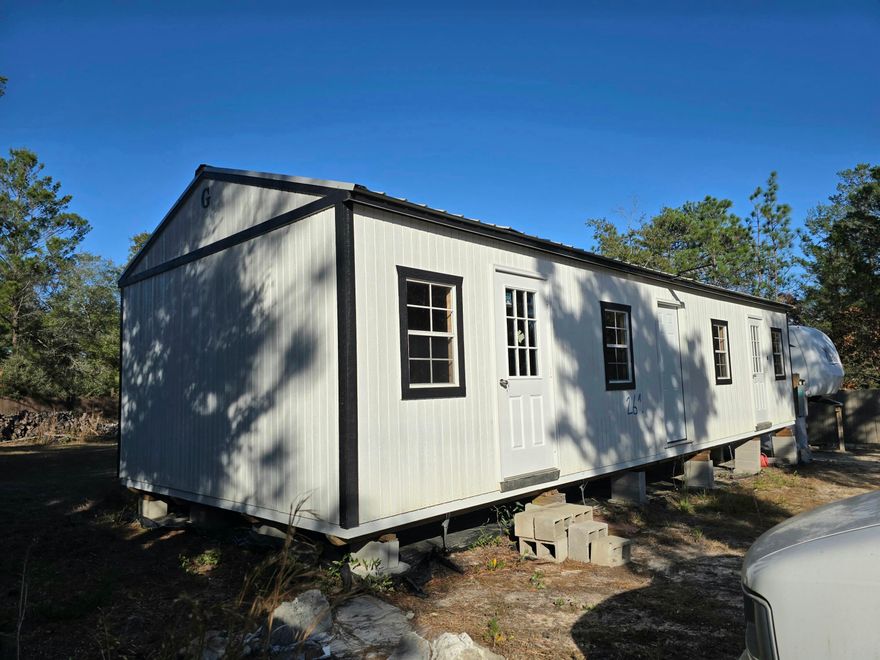 Discover the potential of this Unfinished home, paired with a utility connected RV!!! The interior has been framed for two bedrooms, each with its own private bathroom and separate exterior access, ideal for rental potential or guest suites. The main portion of the home is designed for an open living/dining/kitchen social area, all rooms framed, ready for a new owner to complete it into a cozy and functional space. The onsite RV, is already connected to utilities, providing a convenient opportunity for anyone seeking to live on the property while completing the home! Highly accessible area, under 2 miles to US-90! Under 8 miles from I-10. Quick commute to downtown DeFuniak Springs, military bases, and our fluffy Destin/Miramar beaches.