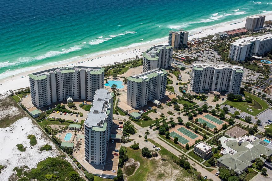 Experience the epitome of coastal living with this exquisite Gulf-front retreat located in the prestigious St. Thomas Building at Silver Shells. Located on the fourth floor, this expansive unit seamlessly blends opulent living with the allure of coastal beauty. Boasting three generously sized bedrooms, each offering breathtaking Gulf views through its large windows, this residence creates a seamless connection between indoor comfort and outdoor splendor. The convenience of a private elevator ensures that you can effortlessly transition from the garage to this haven of relaxation and luxury. Step into the spacious and well-appointed kitchen and living space, which is not only a culinary enthusiast's dream but also an ideal space for hosting gatherings and entertaining friends and family.  The extensive covered balcony provides you with a front-row seat to the mesmerizing pool area and the panoramic views of the emerald expanse of the Gulf Coast. Nestled within the Silver Shells community, this residence not only offers an exceptional living space but also grants access to a vast array of world-class amenities. You can enjoy a top-notch meal at the on-site Ruth's Chris Steak House or rejuvenate your senses at the full-service spa. For those who seek an active lifestyle, there is a well-equipped gym and facilities for tennis, pickleball, and basketball. The St. Thomas & Silver Shells pools provide a refreshing aquatic retreat, while the direct beach access ensures that your toes are in the sugary white sand within moments. Let's not forget the beachside bar, which caters to your every desire, making it the perfect place to unwind after a long day on the beach. This listing also includes a single parking space and onsite storage, ideal for all your beach accessories, providing even more convenience to your coastal lifestyle. The St. Thomas Building is conveniently located in Destin being just a short distance from numerous restaurants, boutiques, and amenities, ensuring that you're always within reach of the best Destin has to offer.