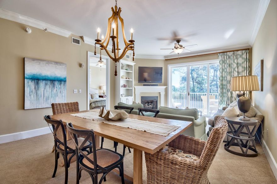 In a 3-story building adjacent to Big Redfish Lake, overlooking refreshingly stunning swimming pools just a mile from the dove white sandy beach sits a charming condo seeking new owners. The low density setting and resort-style amenities make this one of the best choices along 30A. Crown molding, panel interior doors, granite kitchen counters, stainless steel appliances and a laundry space create a comfortable, functional home. The open concept assures that no one is left out of the conversation at the breakfast counter, dining table or living room with fireplace, white mantle and lovely bookcase with lower cabinets. Three bedrooms along with three and one half baths add to the appeal, along with the spa retreat master bath. A spacious, covered, outdoor deck, accessible from the living room or master bedroom, overlooks a tranquil, nature preserved setting. Move-in ready is superlative here, as it comes furnished with pleasant, attractive furniture, fine window treatments and fun decorative accessories. A fitness center, covered parking, fire pit, outdoor grills and private cabanas poolside are here for residents, but it could be the water taxi taking you to the beach (March-October) that tips the scales in favor of buying at the Sanctuary at Redfish.