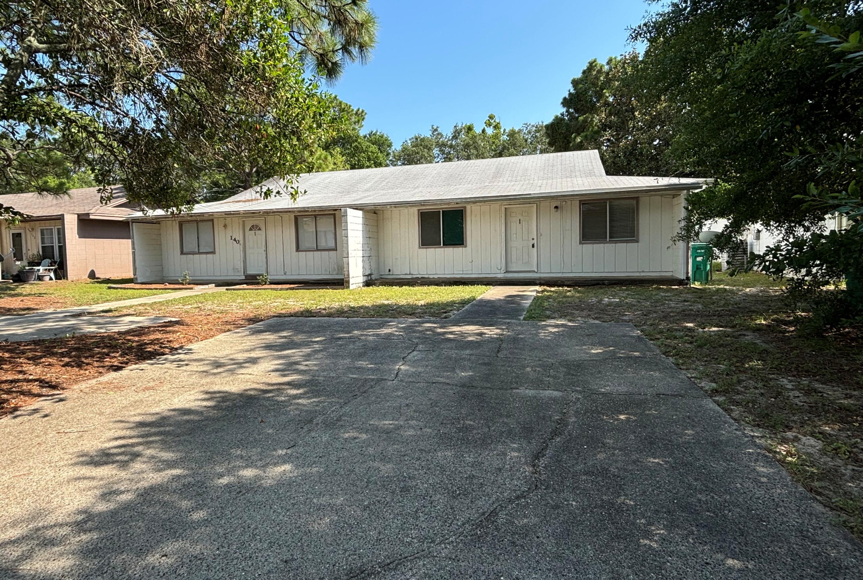 Investor's Dream! This single-story duplex in the heart of Shalimar offers a fantastic investment opportunity. Each unit boasts 2 spacious bedrooms and 2 full bathrooms. Washer/dryer hookups are conveniently located inside each unit. The property features an abundance of parking space and a large backyard, perfect for outdoor activities or potential future improvements. With its prime location and excellent amenities, this duplex is a rare find. Cash offers only. Showing of the vacant unit only at this time. If serious about purchasing, we will schedule a 2nd showing of the occupied unit.