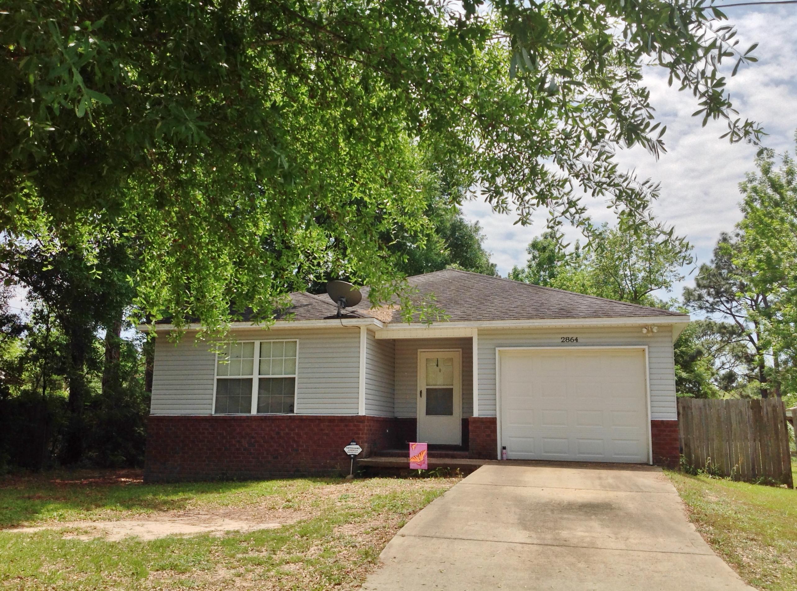 Almost half an acre in the heart of Crestview, convenient to everything! This charming 3 bedroom, 2 bath home invites you to own the American dream for an affordable price! Living room has vaulted ceiling. Kitchen features breakfast bar, smooth top, self cleaning oven, built in microwave and pantry. Dining area has plenty of room for a large table. Step onto the porch that's perfect for grilling. You'll be the center of entertaining with this large yard featuring a wonderful fire pit! Whole house is wired for internet. Satellite for Dish TV conveys. Split bedroom floor plan gives privacy with large Master, and walk-in closet on one side and 2 other bedrooms, plus full bath on the other. Deep, 1 car garage with shelves, attic storage and security system complete the picture! Welcome Home!