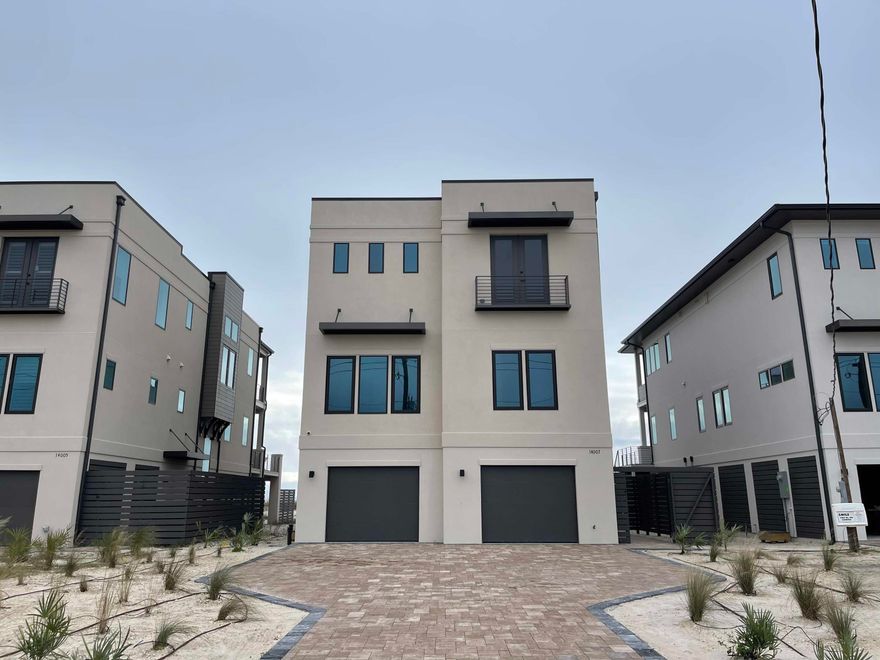 Where modern luxury and quality meet - limited opportunity on Perdido Key. Viviana, Perdido Key's latest development of 12 single family homes each with their own pool and outdoor entertainment space, elevator, gas stove, grill and 2 On- demand gas hot water heaters, gas fireplace, 3 car garage, over 6500 sf of living space with 3600+ sf of heated and cooled gulf front living - directly on the beautiful white sands of the Gulf of Mexico, 5 bedrooms and 5.5 baths of exquisite modern coastal construction by a leading coastal home builder.. Features include: Stucco exterior, TPO roof, 2 x 6 construction, 10' beams, elevator to each floor, top floor master suite and living/kitchen area, 2nd master suite on 2nd floor overlooking gulf, and more....