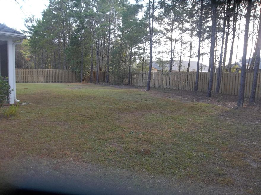 4 Bedroom, 2 bath with tile floors throughout all living areas, new carpet in all four bedrooms. Large lot, fenced backyard with covered screen porch,irrigation well and concrete patio with natural gas grill included.