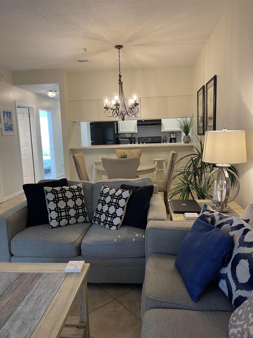 Enjoy a vacation lifestyle all year long in this amazing two bedroom, two bathroom, fully furnished, ground floor unit located in Pointe of View Condominiums. Take a short walk to Grand Boulevard for unique shopping, and dining experiences. Or take a short drive to sun on the pristine sugar sand beaches of the Gulf of America. Vacant, and easy to show, text Karen to view. 850-375-7000.
