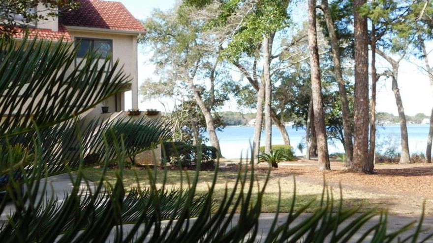 Beautiful Water view Townhome overlooking the bay from your living room, dining room & sun room. Nicely appointed with Bamboo flooring , freshly painted and in a desirable ''Marina life style'' location. Walking distance to the Bluewater bay Marina, golf course, dining and water sports. You can watch the beautiful sunsets over the bay and enjoy the true beauty of Florida.