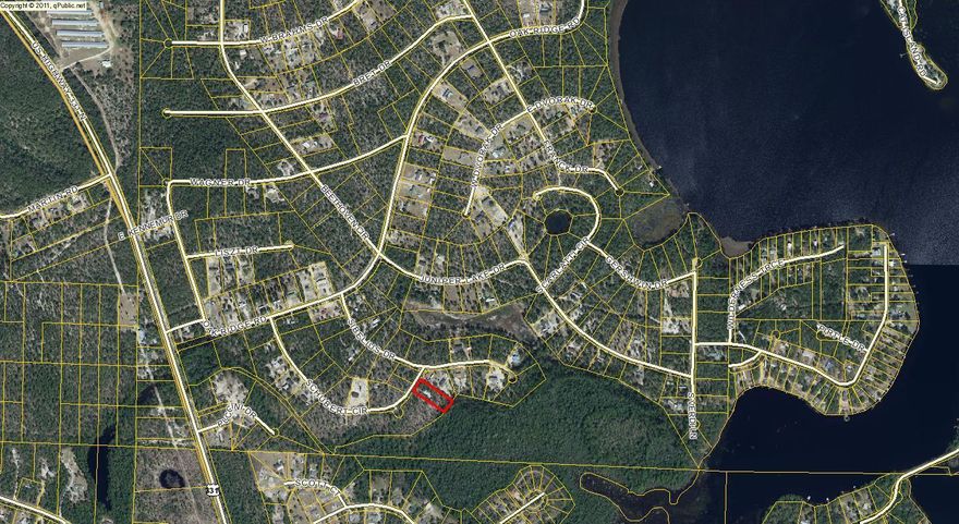 Nice roomy home site, close to an acre.Crushed rock driveway. County water comes to the property. Can also access by Sibelius.