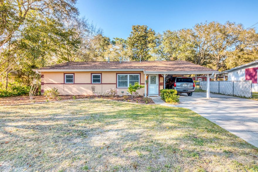 Lovely Florida Cottage just minutes from Eglin. No garage, no problem when you have a large workshop in the backyard with full power! Entering the home through the formal living room you will notice the brand-new flooring and large open area. From there you can access the kitchen & dining room with tiled floors, large pantry & solid surface counters, or down the hallway there are two additional bedrooms and full guest bathroom. The master bedroom is very spacious and master bath complete with a walk-in closet, large shower, & double vanity sinks. One of the additional bedrooms has access to the master bathroom making it a great nursery, office or bedroom. Through the dining area is the laundry room with a half bath & access door to the carport.