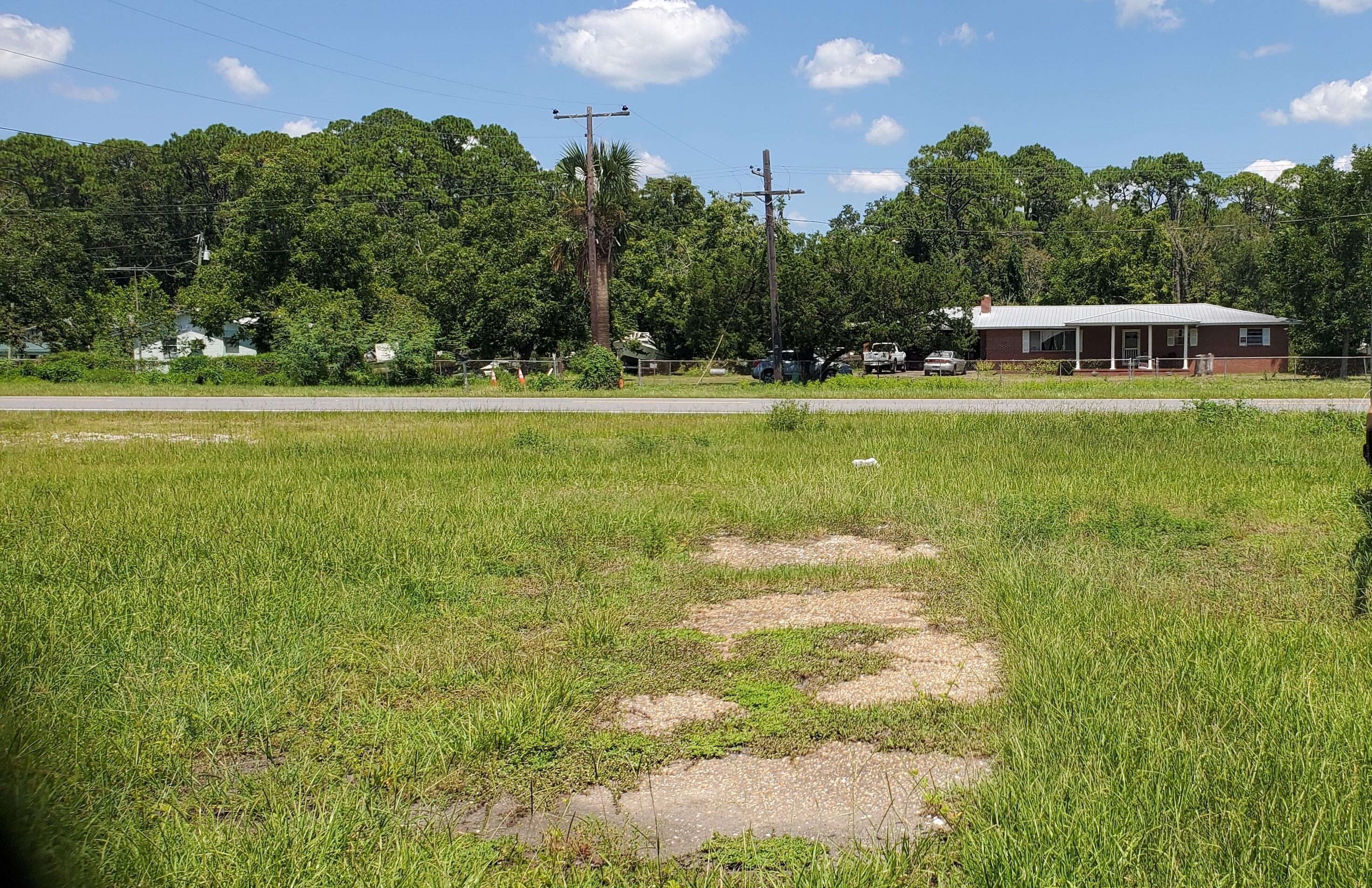 Fantastic Opportunity to own a little piece of Apalachicola History. This home sits on a 3.13 acre parcel with mixed use opportunities! This all brick home has a metal roof, 2 car carport and has been loved and cared for through the years. A well designed floorplan with great living space, large bedrooms, and lots of space to grow and prosper. Sit on your front porch and get a glimpse of the Bay while enjoying your morning coffee or evening cocktail. There are also lots of producing Pecan trees and Orange trees to enjoy. A property such as this one has so much offer and do not come on the market very often. The possibilities are endless! Call today!