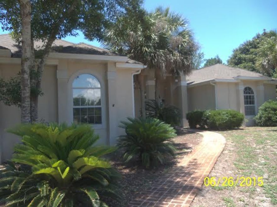 REO LISTING. Custom built, real stucco home on golf course overlooking a small pond. Home has 10' to 12' ceiling with 15' ceiling in the family room. Home has the highly desired split floor plan. The family room has a built in entertainment center. When you enter the front door of this home, you will have a direct view of the screened lanai, heated pool and spa. Kitchen has tile flooring and new appliances, to include the 2 disposals. New carpet. Interior freshly painted. All dimensions to be verified by the buyer. DON'T WAITYOU'LL BE TOOO LATE!!!