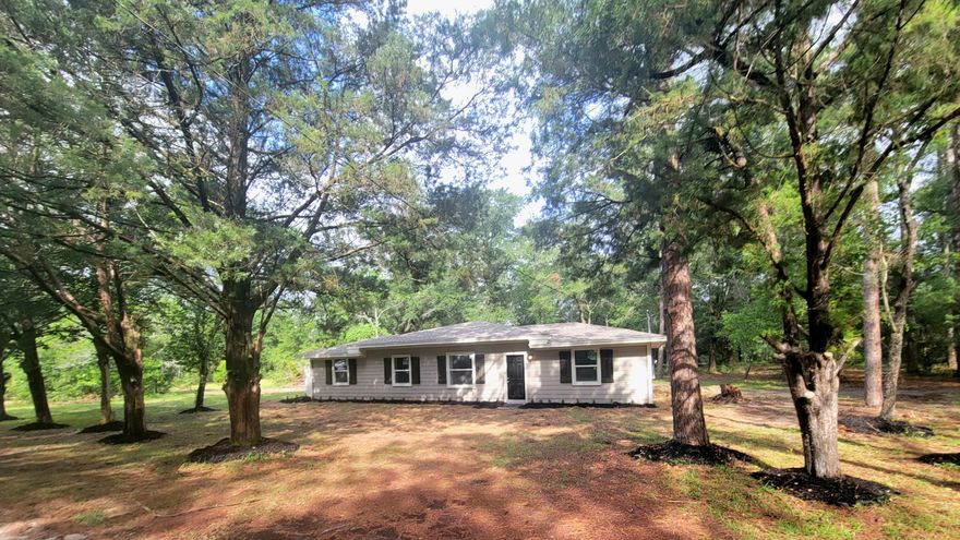 1.26 acres in the city limits of DeFuniak Springs with a totally remodeled and updated home with new roof new hardy board siding over block,  updated plumbing, electrical and new a/c, new hot water heater.  This house is decorated in the popular white walls and black cabinetry and breakfast bar/dining table. New stove, dishwasher and flat screen TV in kitchen. The colors of this home are  beautiful. You have split- floor plan -4 bedrooms, 2 baths and an inside laundry room.  Master bath has a beautiful stainless steel sink you will love.  Well shaded super-size back yard for a city home.  Partially enclosed privacy  patio on the south side of the home for early morning coffee. Plenty of room for the kids and their toys and pet.