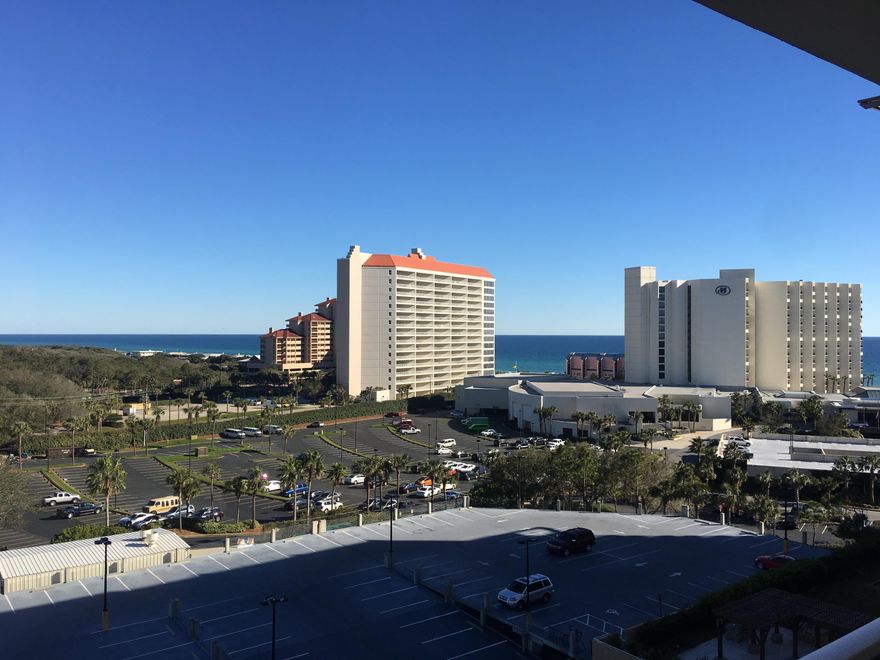 Enjoy the lovely West facing view from the  private balcony of this 7th floor lock out condo. You can see the Gulf and the Bay. Updated flooring, stylish decor, a real must see. Lagoon style pool with waterfall and all the amenities you are looking for. Just a short stroll to the beach and tram services are also available. Plenty of room for the whole family and you can also take advantage of vacation rental opportunities. You can rent out the entire condo as one or rent it separately as a one bedroom and a studio. Sandestin is the premier resort, make it part of your beach lifestyle. Buyer to verify all information. HOA is $646.23/month and $383.93 /qt for the master HOA, this equals $774.21 /month.