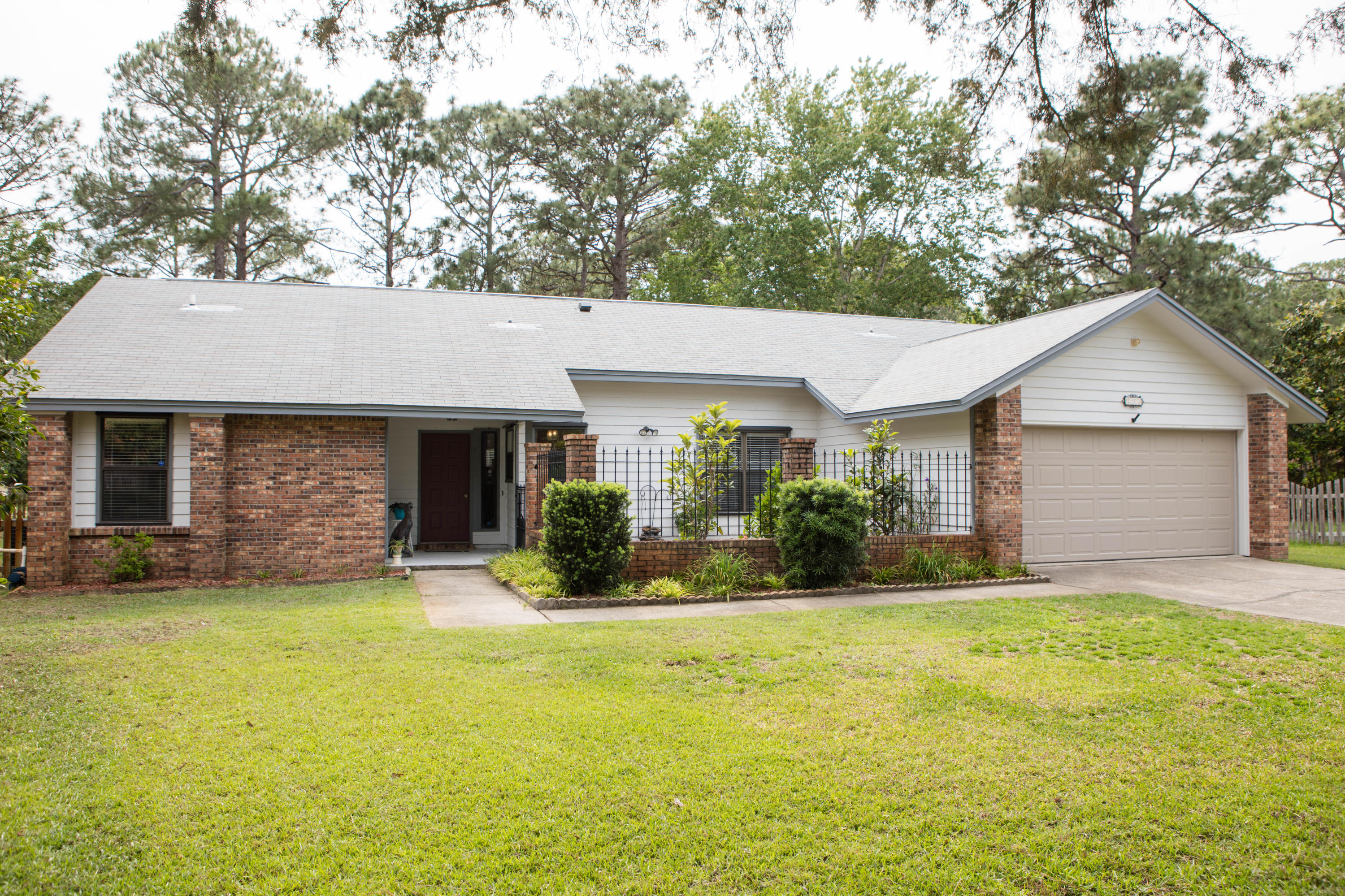 Bluewater Bay. Split Bedroom Design. Cathedral Ceiling. Brick Fireplace with Blower. Tile Flooring. New Custom Kitchen. Full Overlay Maple Cabinets. Appliance Garage. Spice Cabinet. Trash Cabinet and more. Mosaic Tile Back splash. Granite Counters. Double Cabinet Pantry. GE Stainless Steel Smooth Top Range with Double Oven and Microwave. Stunning Pendant Lights. Beautiful Tile.Abundant storage. Florida Room. Plantation Shutters. Trex Deck. Custom Laundry Room with Cabinets and Sink. New Paint, Doors. Blinds. Guest Bathroom has New Vanity Top, Lighting, and Faucet. Master Bedroom has Walk-in Closet. Master Bath with New Double Vanity, Top and Faucets. Hurricane Shutters. Newer HVAC System/Water Heater. Oversized Garage. Courtyard. Access to 1st Tee of 9th Green. Decorative Fence. A fantastic home in Bluewater Bay. The garden courtyard with paver bricks and wrought iron make for picturesque setting. The split bedroom floor plan is highly desirable to today's buyer. The New Custom Kitchen has every imaginable upgrade and storage that is absolutely incredible. From the stunning maple cabinets to beautiful granite counters. This kitchen does not disappoint. Mosaic backsplash, gorgeous pendant light over sink and breakfast nook area. Cabinets provide a spice rack, a trash drawer, a glass display, a corner lazy Susan and an appliance garage. The flooring is a tile that looks like wood. The family room with cathedral ceiling, brick fireplace with hearth and mantel. The dining room has 2 storage closets and new light. The master bedroom is very spacious with ceiling fan and walk-in closet. The master bathroom has recently been upgraded with vanity cabinet and cultured marble top, lighting, faucets, and towel bars. The master bedroom leads to the Florida room which is heated and cooled with plantation shutter. The newly designed Laundry room is off the Florida room with tile flooring. lots of cabinets for storage, sink, and folding counter space. Outside you will see the 12 x 12 Trex decking so no worries about replacement of worn out wood. The pick fencing is an accent piece to the large yard that leads to the 1st box of the 9th green on the Marsh course. The additional two bedrooms have ceilings fans and one with decorative wainscoting. The guest bathroom has been upgraded with new vanity, top, faucet, mirror and light. New six panel doors throughout, freshly painted and new blinds. The garage is oversized with work area or storage area for lawn equipment. The sprinkler system with lawn pump makes keeping the grass green with minimal cost. The HVAC system was replaced in 2012 and the water heater was replaced in 2014. A termite bond in place and will transfer to homeowners. A one year home warranty will be provided at closing. Schedule your private showing today!