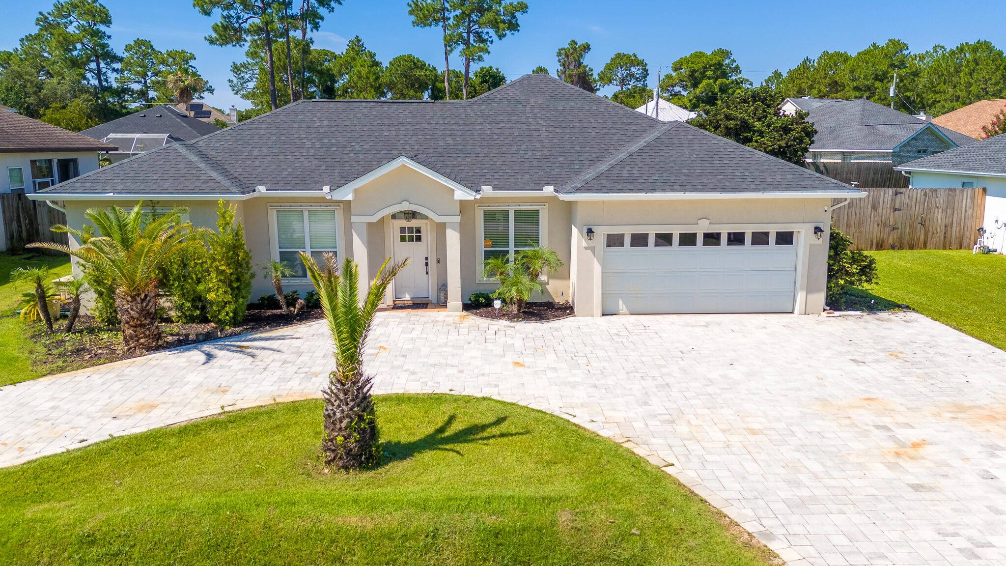 Located in a quiet, no-HOA neighborhood in Miramar Beach, this beautifully updated four-bedroom, two-bath home offers a circular paver driveway with ample parking, a heated and cooled two-car garage, an amazing back yard with pool and hot tub, and a separate heated and cooled she-shed plus whole house generator. Inside, the one-story open floor plan showcases quality finishes with high ceilings and crown molding throughout. Recent updates include a remodeled kitchen with quartz counter tops, tile back splash and new appliances, lvp flooring, a living room addition, and more. The spacious living area showcases a gas log fireplace and pool views flowing into a large dining room and breakfast nook. While a versatile fourth bedroom right off the entry, could be utilized as an office.