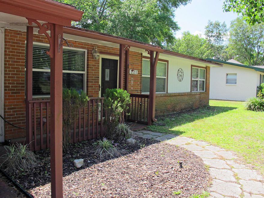 This charming house in a quiet residential neighborhood in central Fort Walton Beach will make an excellent starter home! Fire up a barbecue on the covered back patio, rain or shine, or gather your chairs around the fire pit on cold winter evenings. The large lot features beautiful mature trees, providing cooling shade for those hot summer days, and plenty of room to play.The home is move-in ready, with a number of upgrades enhancing the attractive living space. The living area flooring is an elegant dark ash gray wood laminate. Newer dual pane windows bring in natural light, and keep electricity use down. The kitchen's sleek cabinets are painted a modern gray, which compliments the newer stainless refrigerator. (continued)